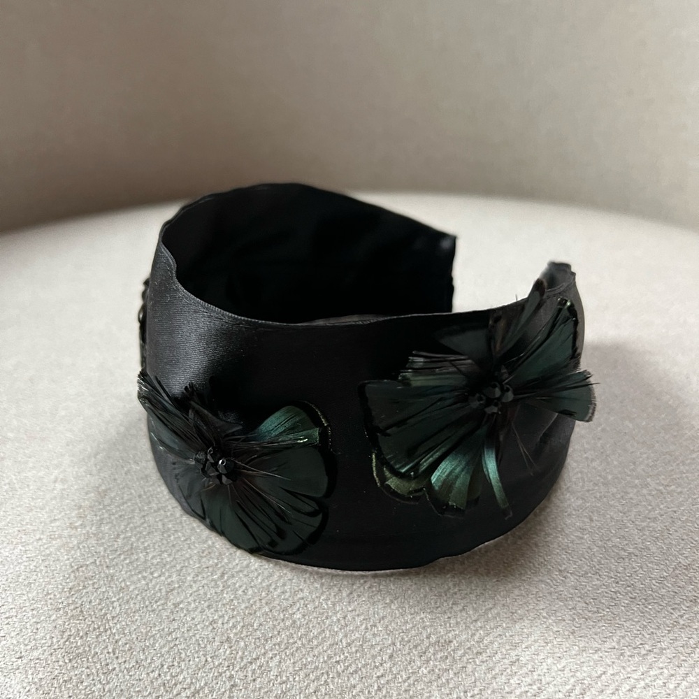 Jennifer Ouellette silk headband with feather flower details.